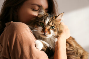 woman holding a cat