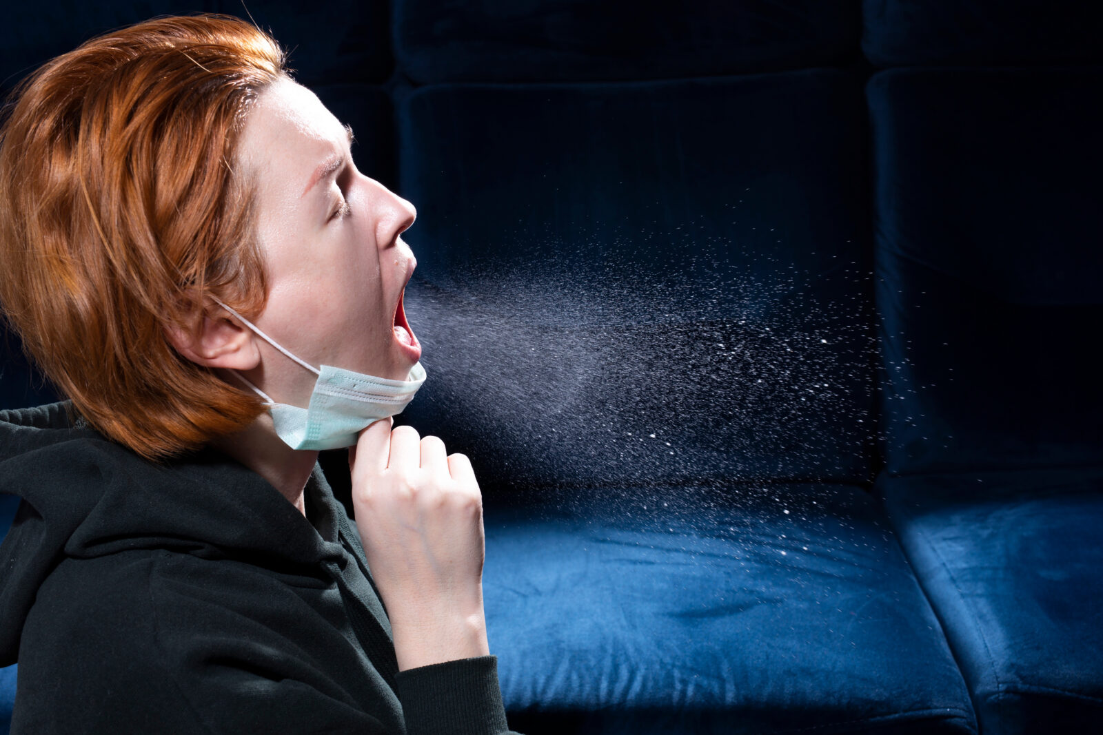 women sneezing out germs